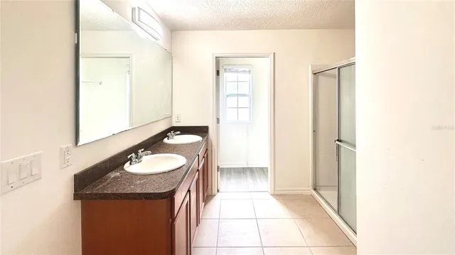 a bathroom with a sink toilet and a mirror