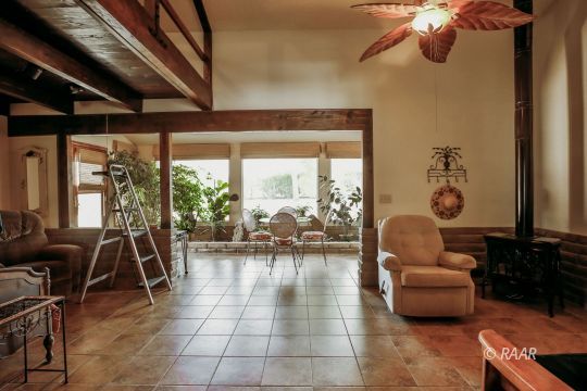 548 East Laura Avenue Ridgecrest, CA 93555 - Photo 20 of 34 a living room with furniture and a large window