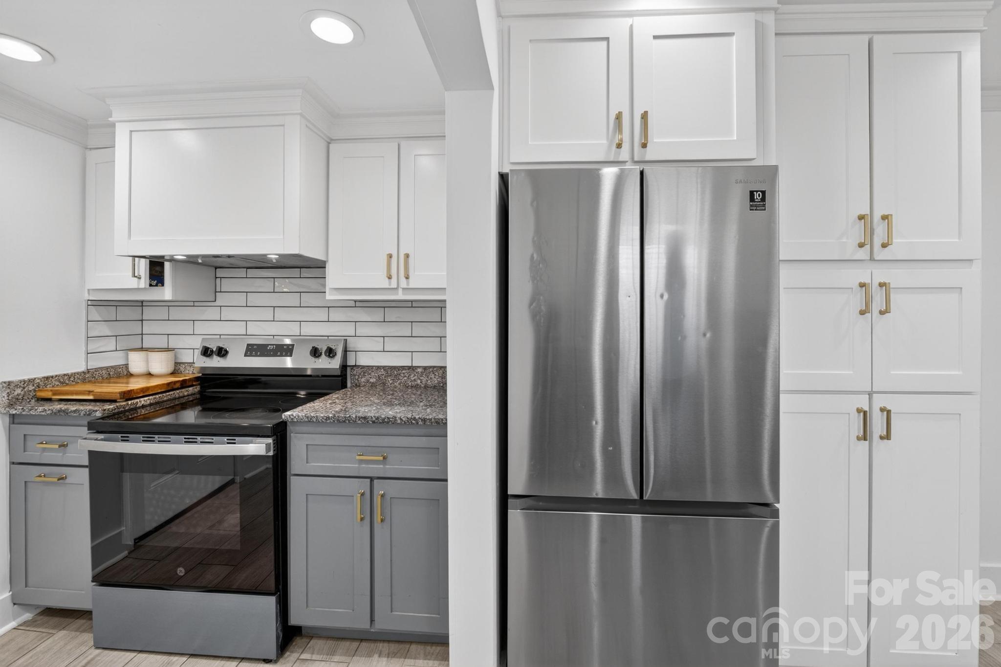 2076 Connelly Springs Road Lenoir, NC 28645 - Photo 18 of 47 a kitchen with appliances cabinets and a counter top space