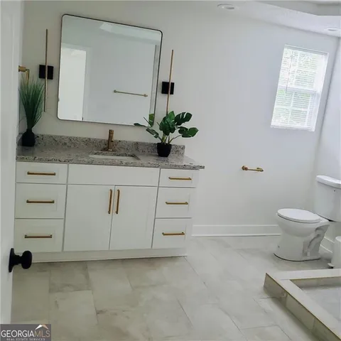 a view of a livingroom with wooden floor