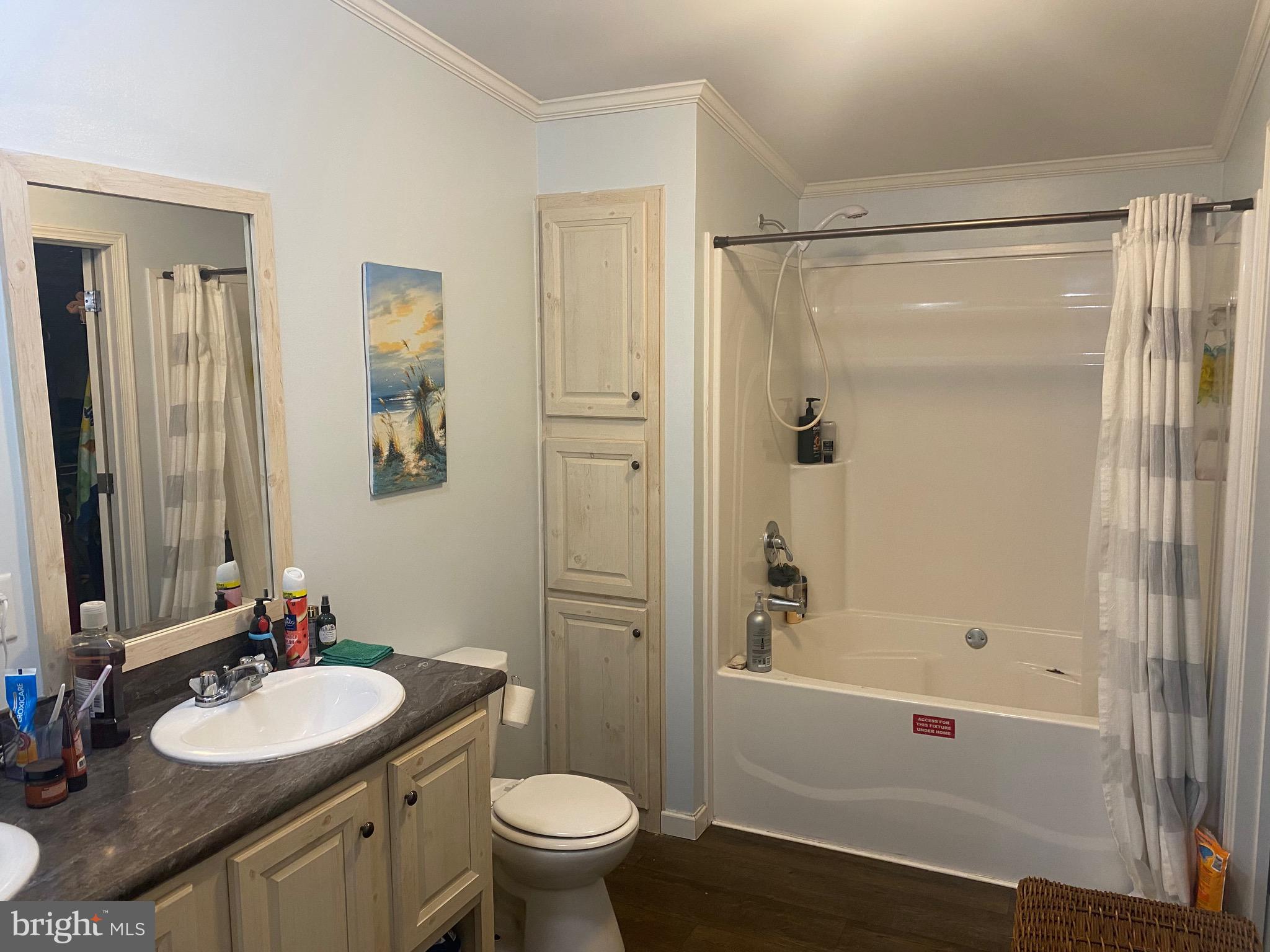 9415 Cherry Tree Lane Seaford, DE 19973 - Photo 9 of 43 a bathroom with a sink a toilet and shower