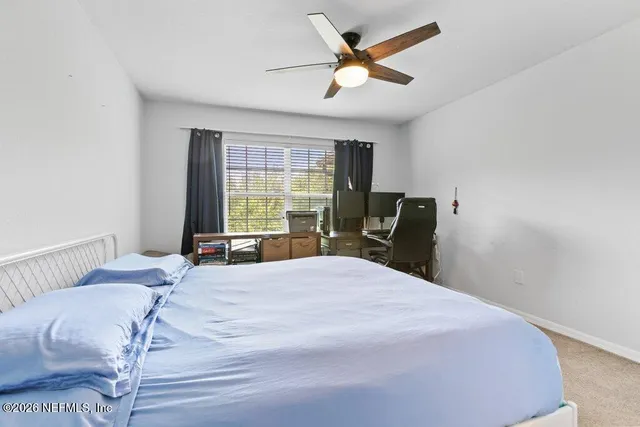 a bathroom with a sink toilet vanity and shower