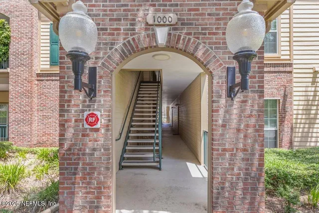 a kitchen with stainless steel appliances granite countertop a refrigerator a stove a sink and a granite counter tops