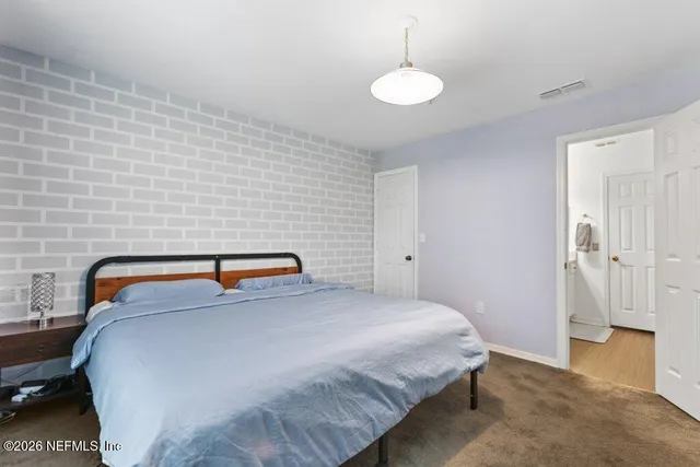 a view of a lake with a building in the background