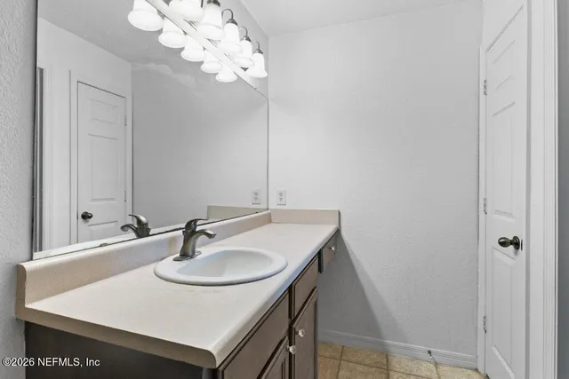 an aerial view of a house with a yard and garden