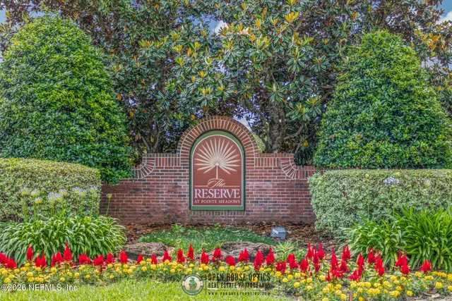 a kitchen with stainless steel appliances granite countertop a refrigerator a stove a sink and a refrigerator