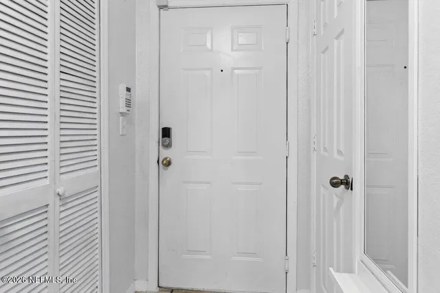 a view of a dining room with furniture and window