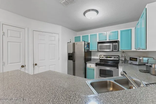a bedroom with a large bed and a large window