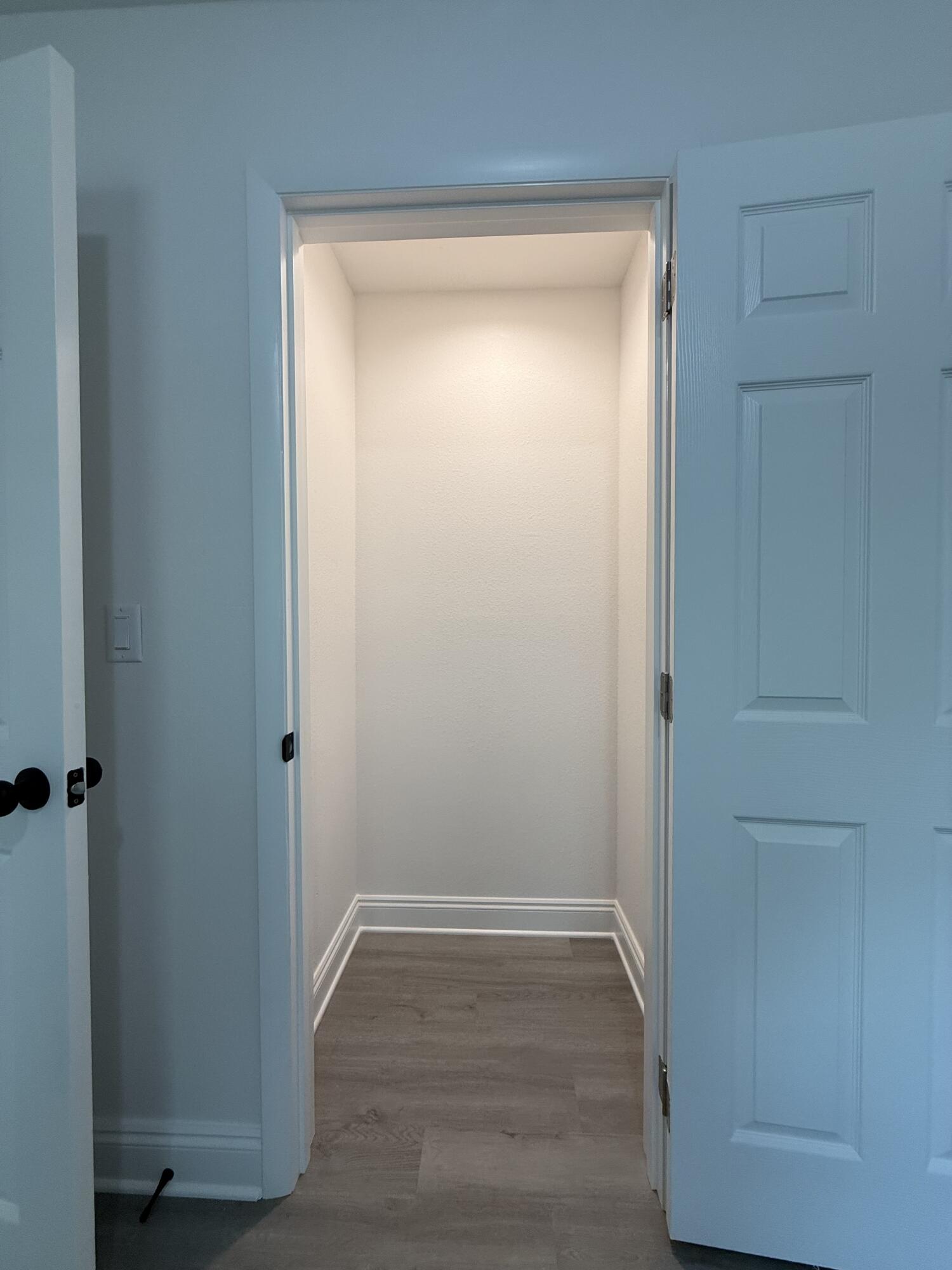 32 Constitution Avenue, Unit AB DeFuniak Springs, FL 32433 - Photo 13 of 22 a view of empty room with wooden floor