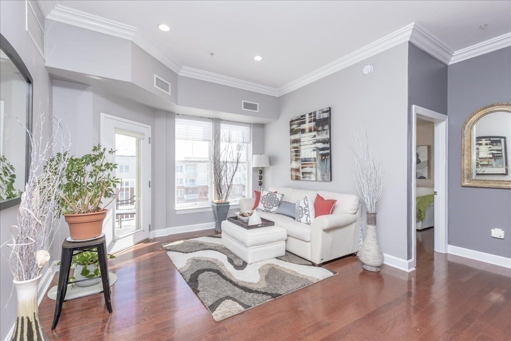 36 Village Road, Unit 706 Middleton, MA 01949 - Photo 20 of 42 a living room with furniture and a potted plant