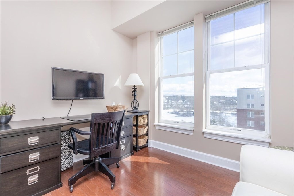 36 Village Road, Unit 706 Middleton, MA 01949 - Photo 22 of 42 a view of a workspace with furniture and a window