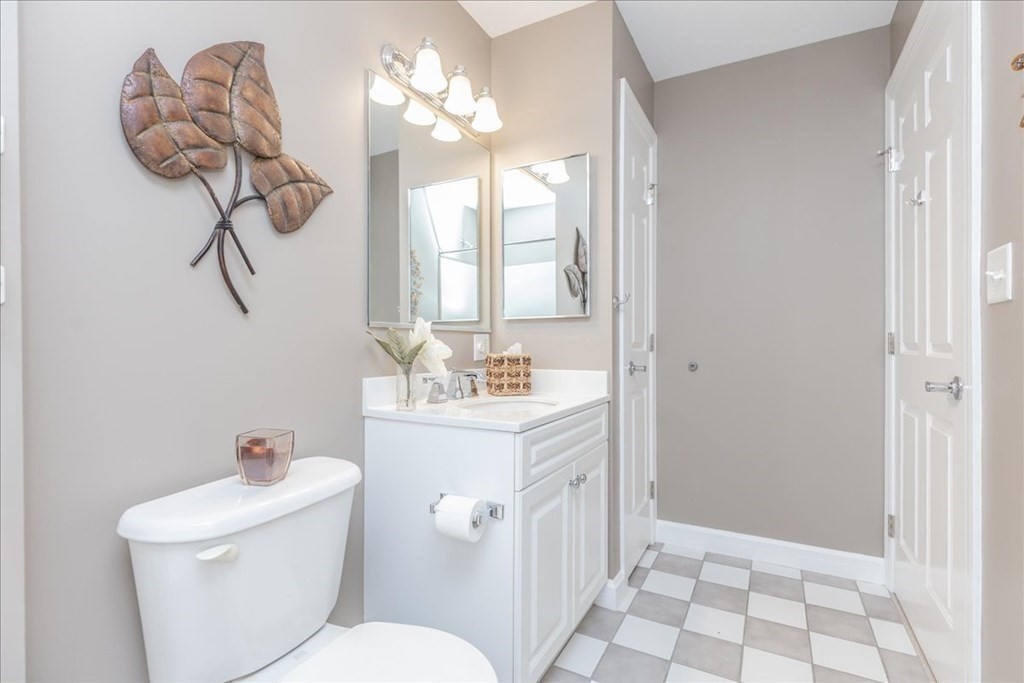 36 Village Road, Unit 706 Middleton, MA 01949 - Photo 25 of 42 a bathroom with a sink a toilet and shower