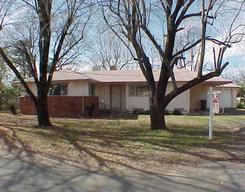 3062 Henderson Road, Unit 1 Redding, CA 96002 - Photo 1 of 1 a view of a house with a large tree