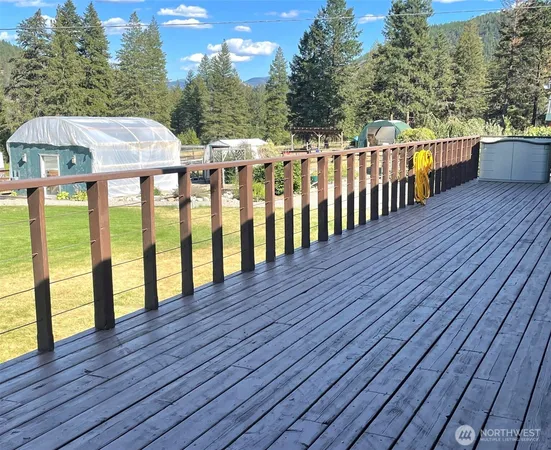 a view of balcony with wooden floor and outdoor seating