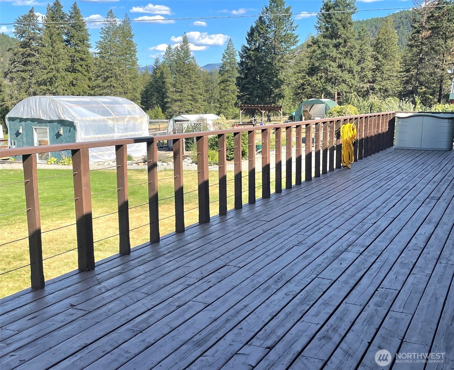 23 Tonata Creek Road Curlew, WA 99118 - Photo 15 of 38 a view of balcony with wooden floor and outdoor seating