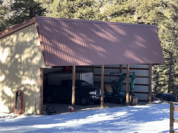 a front view of a house with wooden stairs