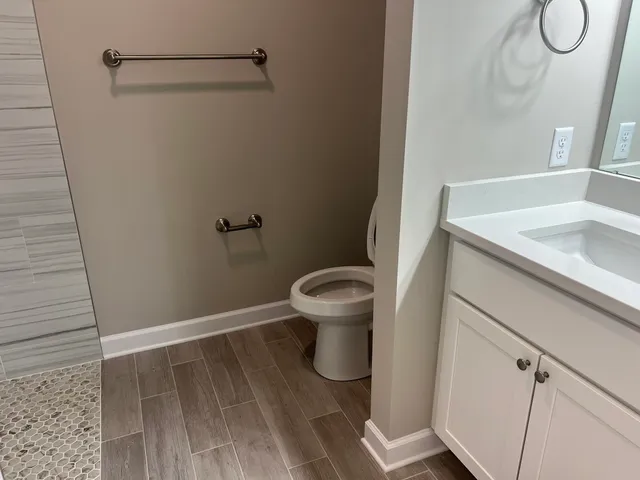 a bathroom with a bathtub and a toilet