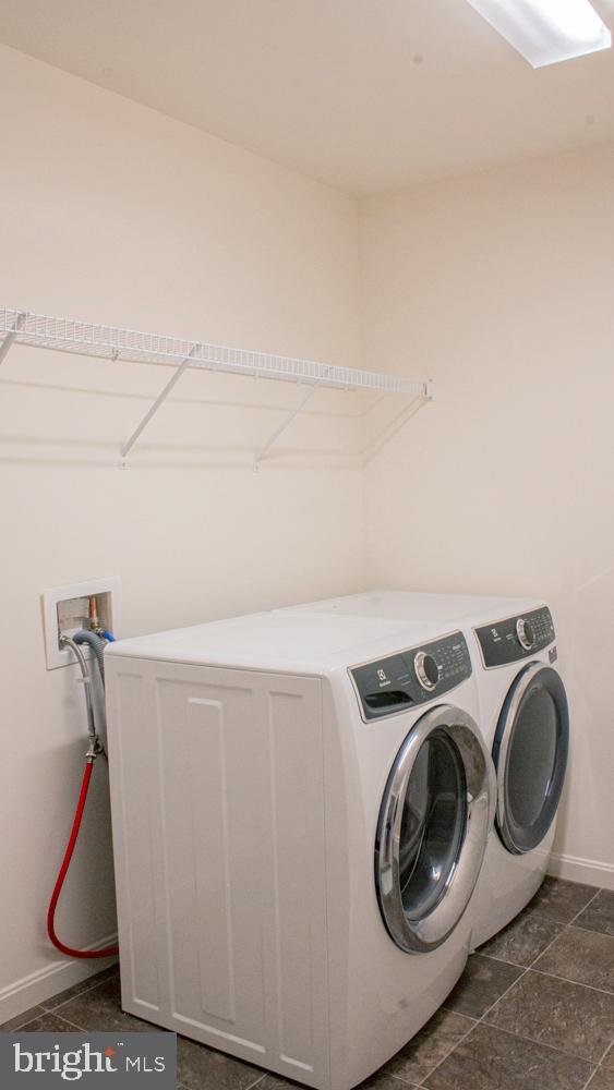 145 Wayland Road Culpeper, VA 22701 - Photo 12 of 14 Modern laundry space with sleek appliances.