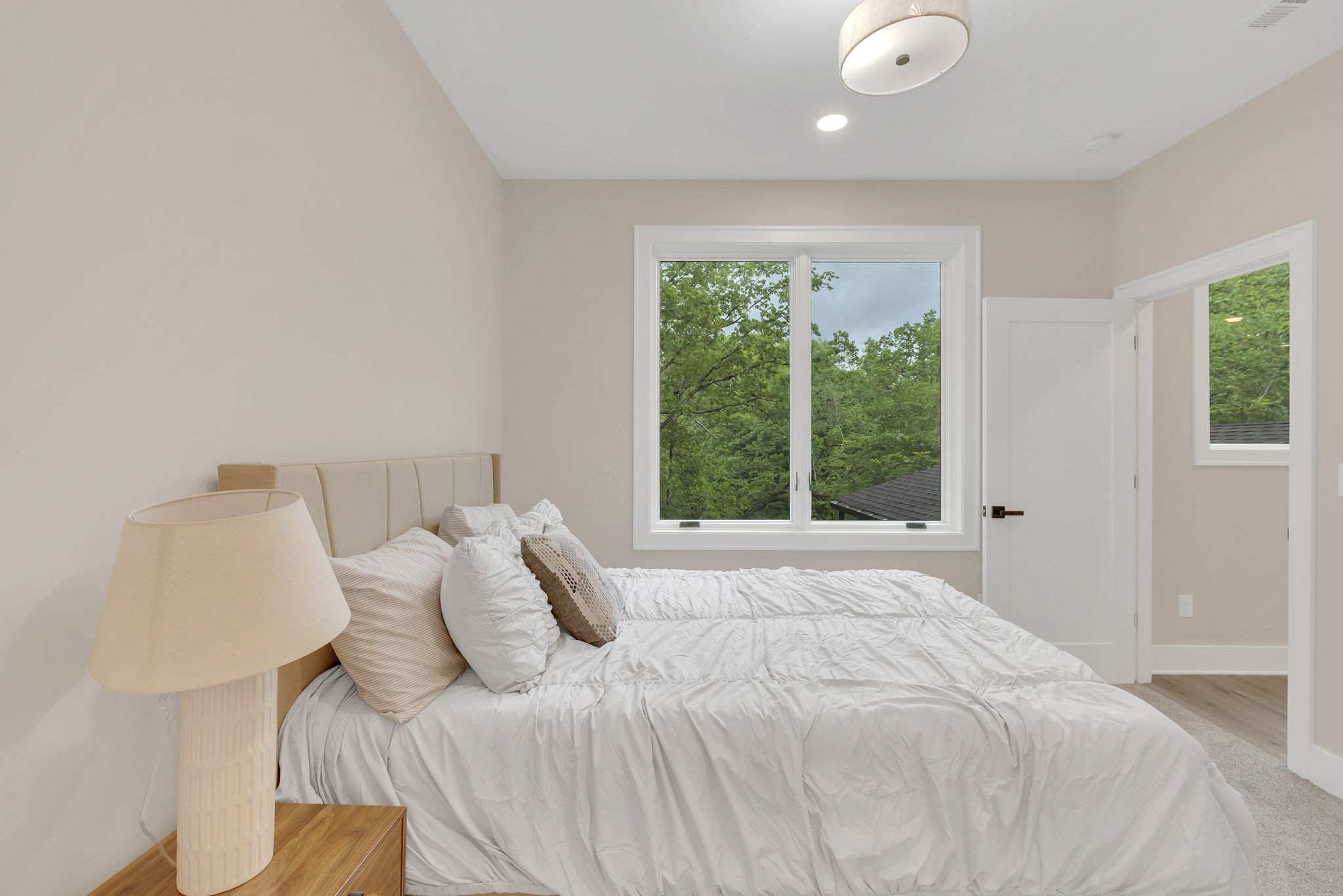 4 Whippoorwill Cove Road Winchester, TN 37398 - Photo 16 of 40 a large bed sitting in a bedroom next to a window