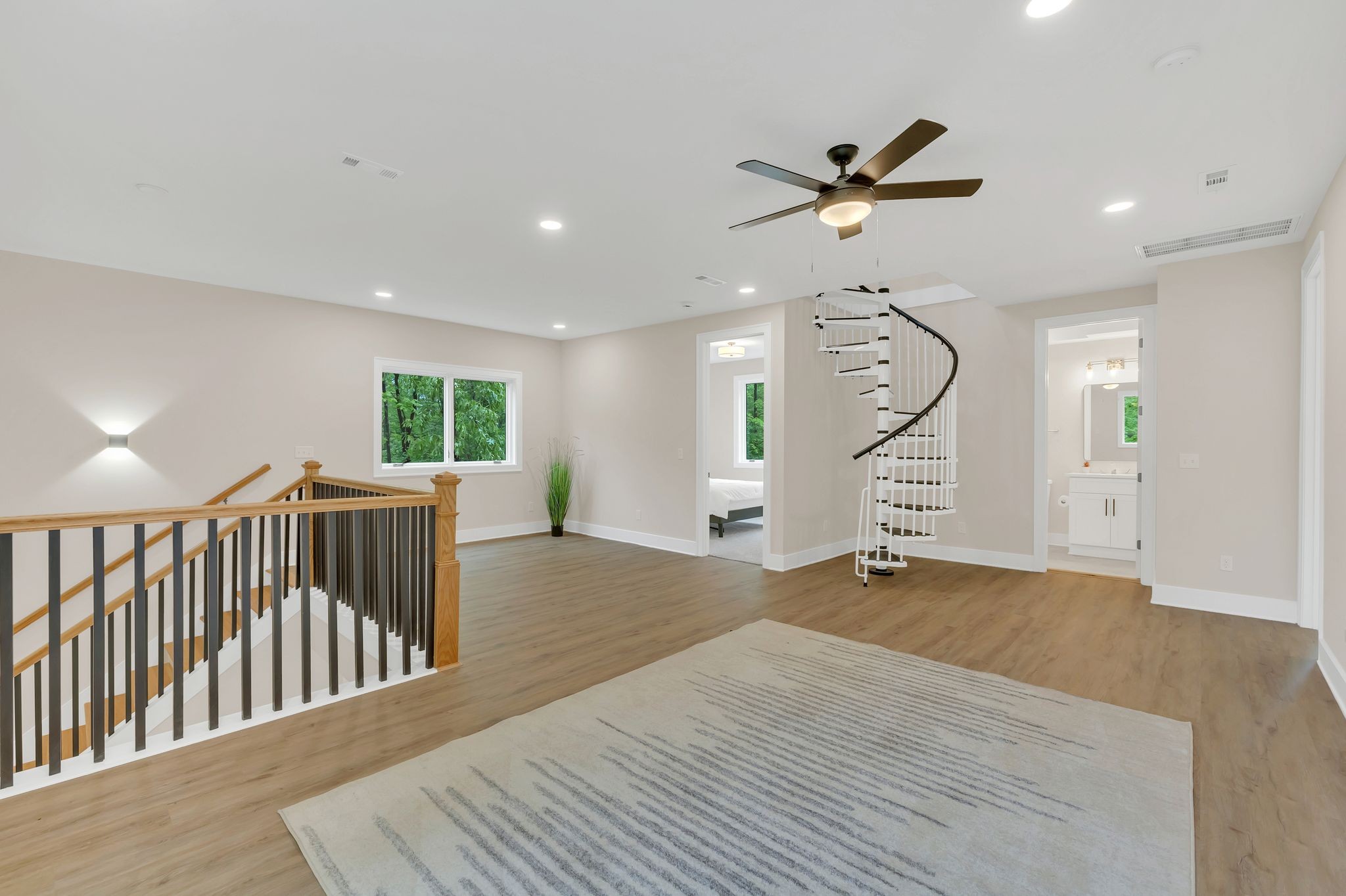 4 Whippoorwill Cove Road Winchester, TN 37398 - Photo 22 of 40 a view of a livingroom with a ceiling fan and wooden floor