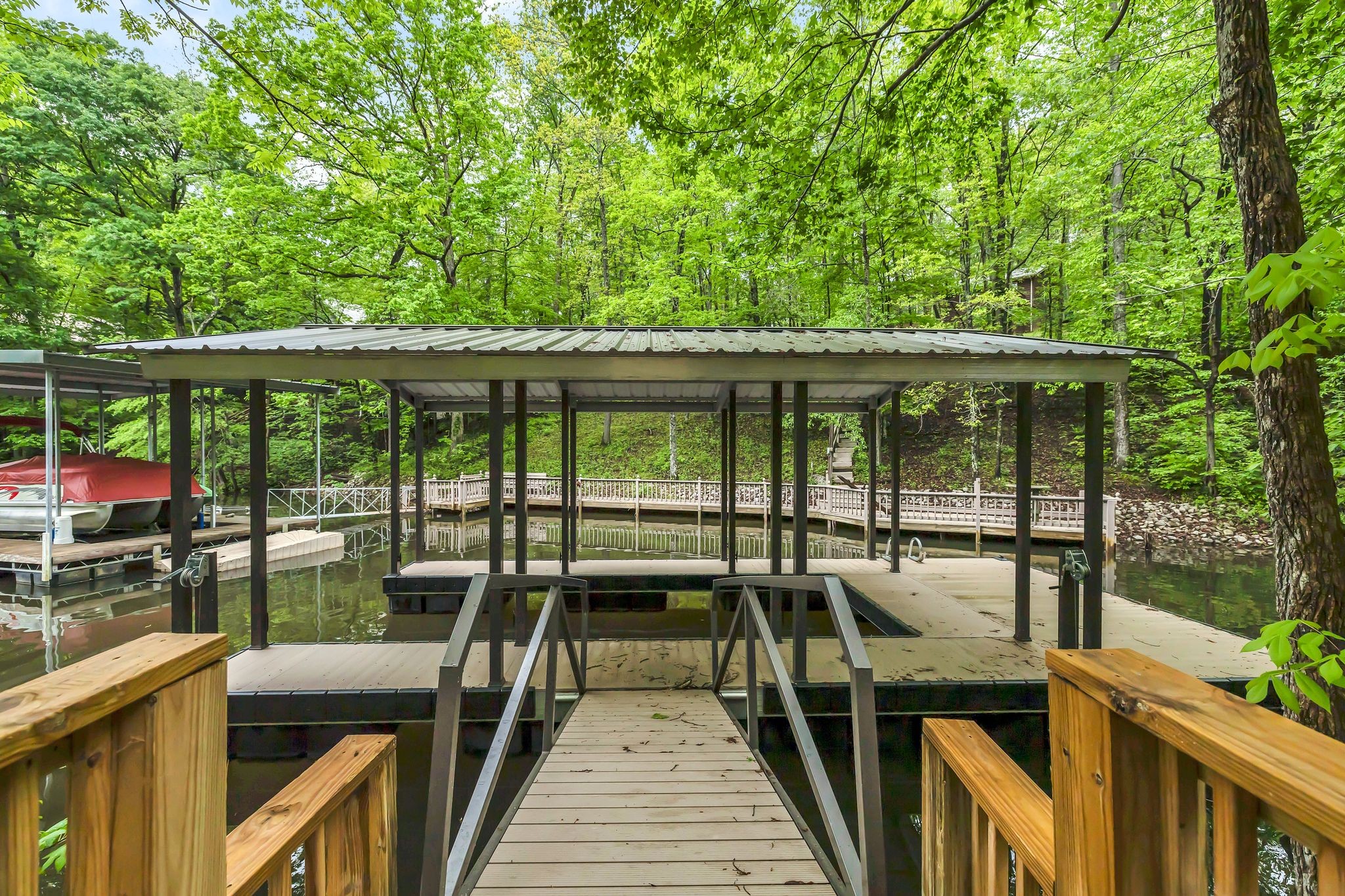 4 Whippoorwill Cove Road Winchester, TN 37398 - Photo 40 of 40 a view of a balcony with chairs and wooden floor