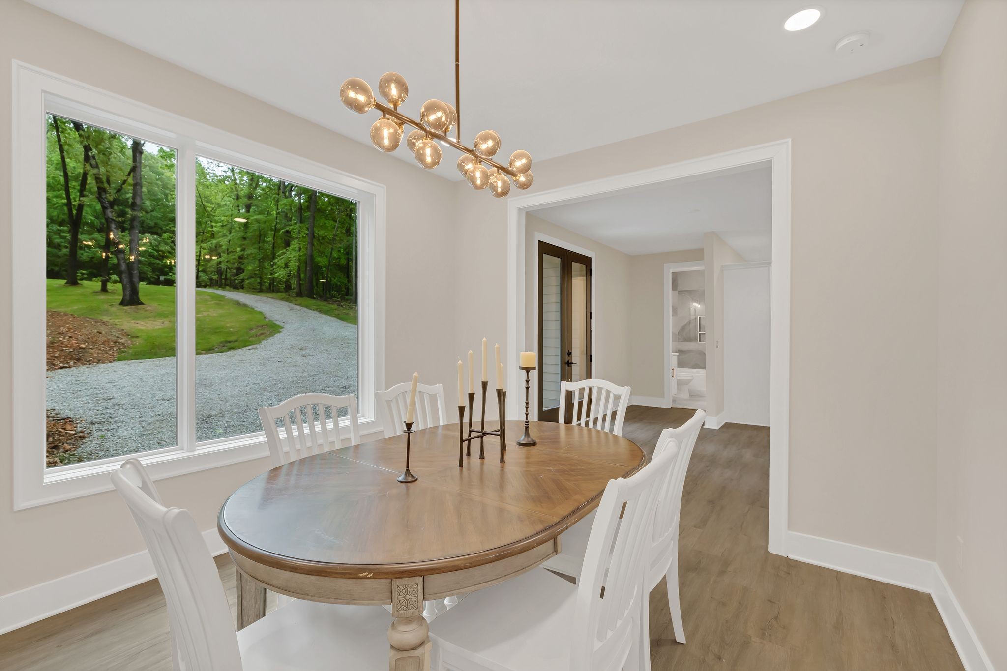 4 Whippoorwill Cove Road Winchester, TN 37398 - Photo 6 of 40 a dining room with furniture a chandelier and wooden floor