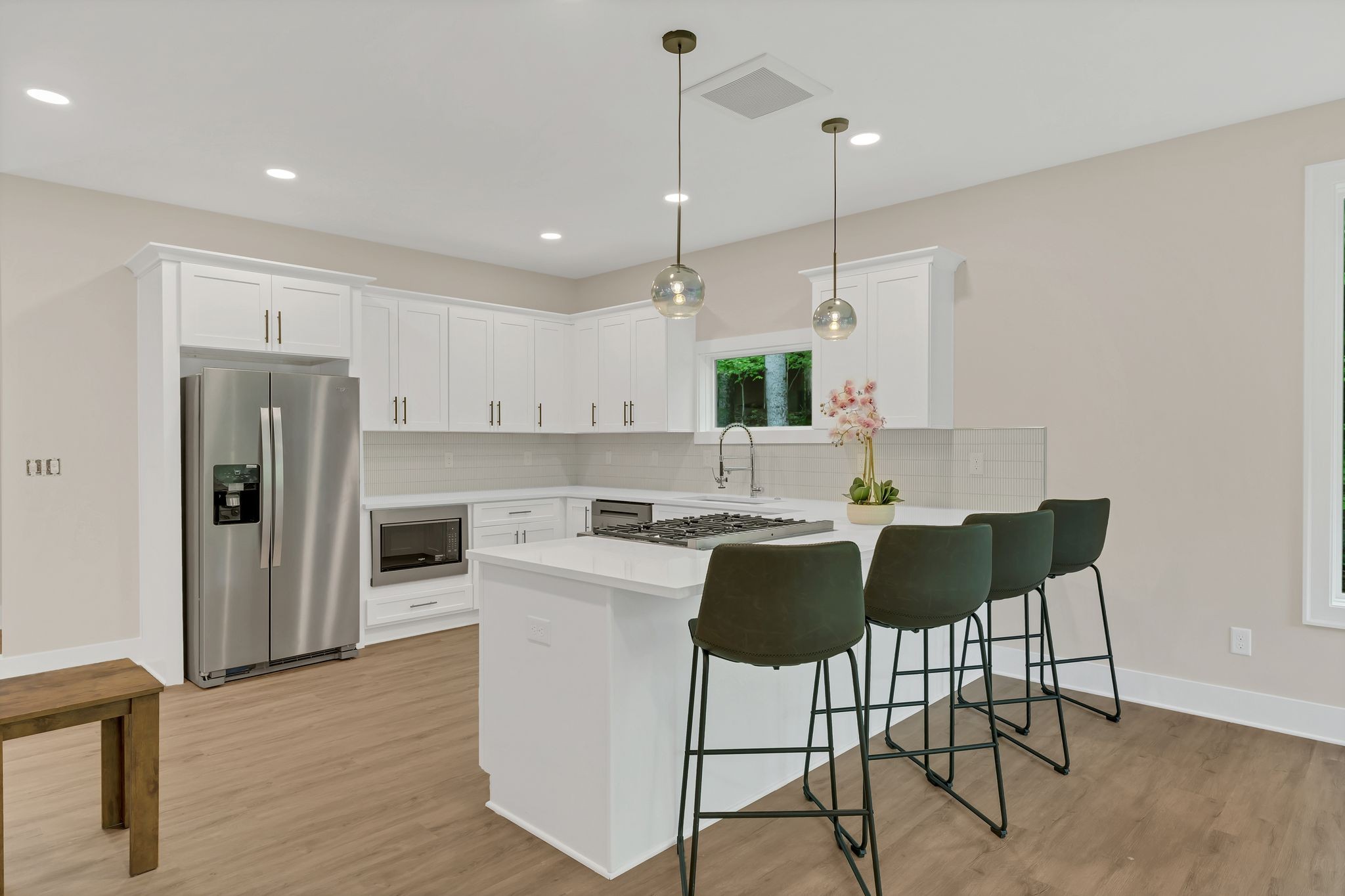 4 Whippoorwill Cove Road Winchester, TN 37398 - Photo 8 of 40 a kitchen with kitchen island white cabinets and stainless steel appliances