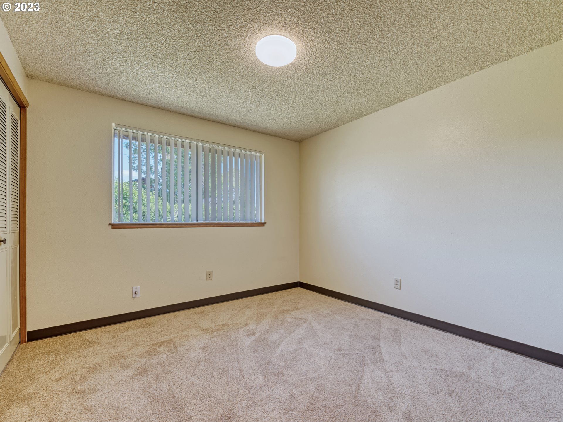 1249 6th Street Springfield, OR 97477 - Photo 11 of 24 an empty room with a empty space and window