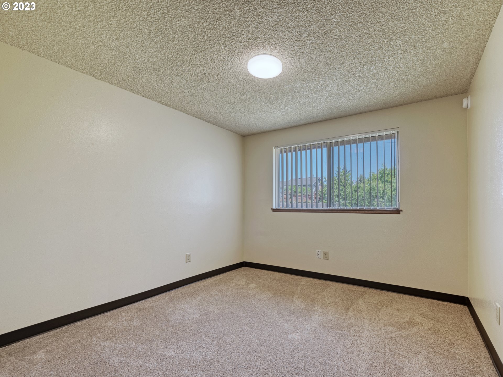 1249 6th Street Springfield, OR 97477 - Photo 14 of 24 a view of an empty room with a window