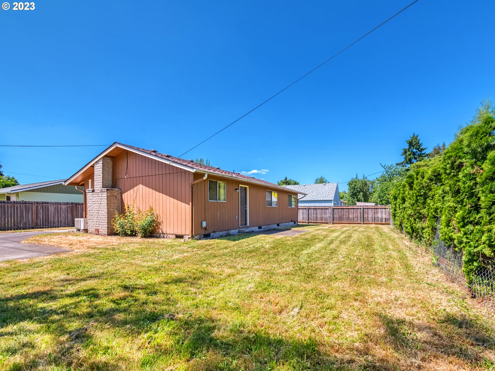 1249 6th Street Springfield, OR 97477 - Photo 21 of 24 a big house with yard in front of it