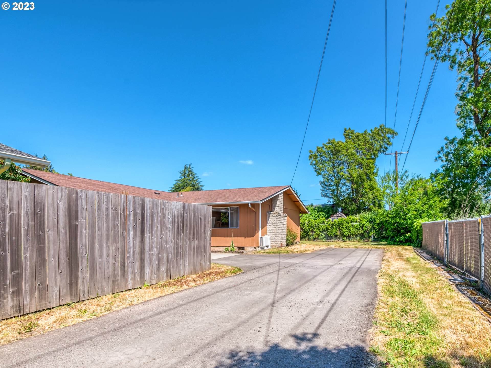 1249 6th Street Springfield, OR 97477 - Photo 3 of 24 a house view with a garden space