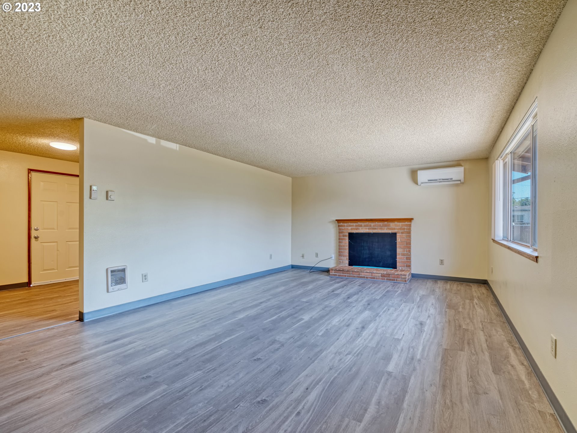 1249 6th Street Springfield, OR 97477 - Photo 5 of 24 a view of empty room with wooden floor