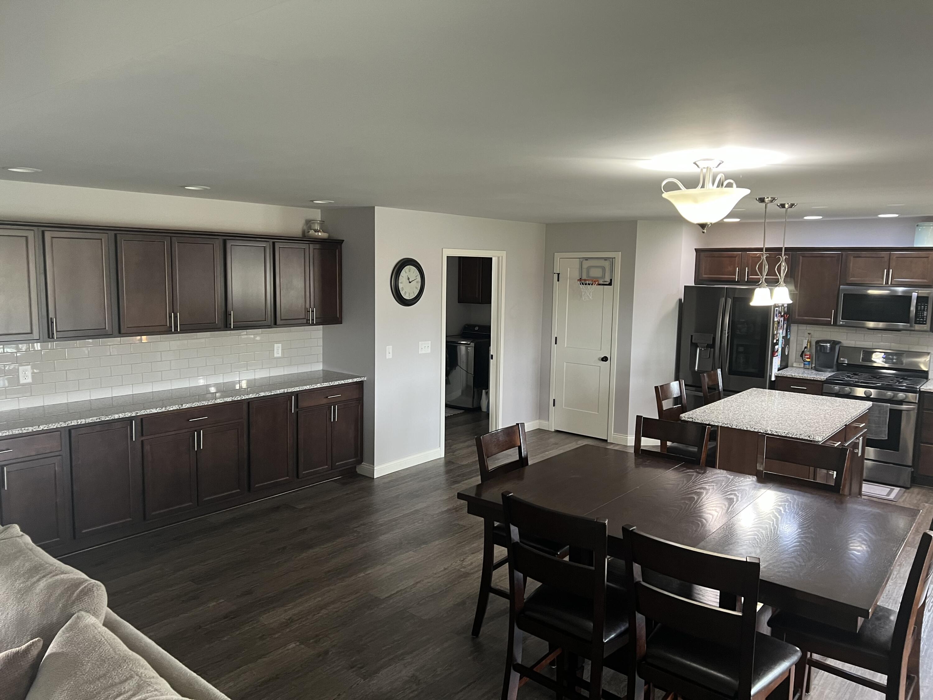 702 19th Street Southeast De Motte, IN 46310 - Photo 8 of 22 a kitchen with a table chairs and wooden floor