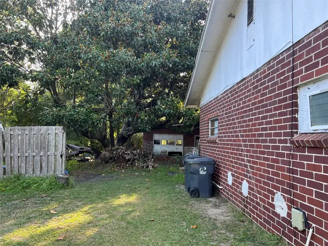 a house view with a backyard space