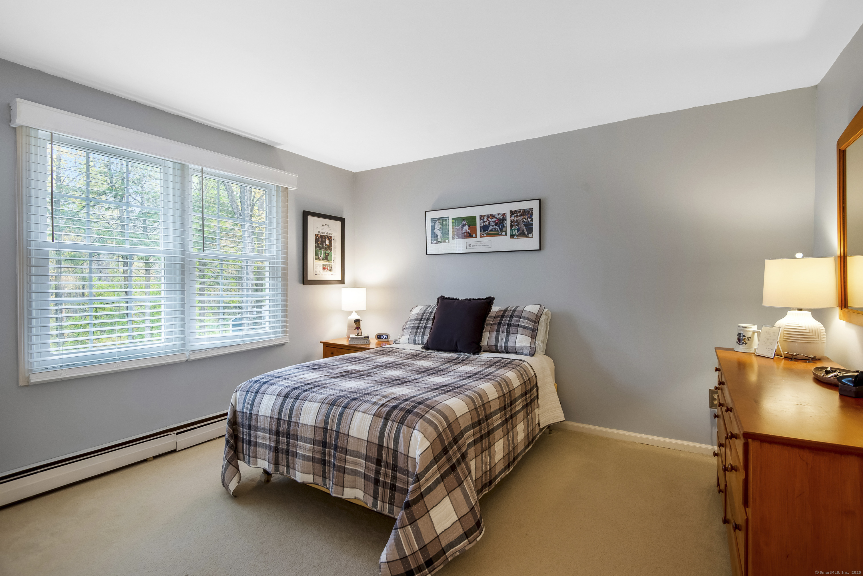 48 Bar Gate Trail Killingworth, CT 06419 - Photo 32 of 40 a bedroom with a bed and lamp