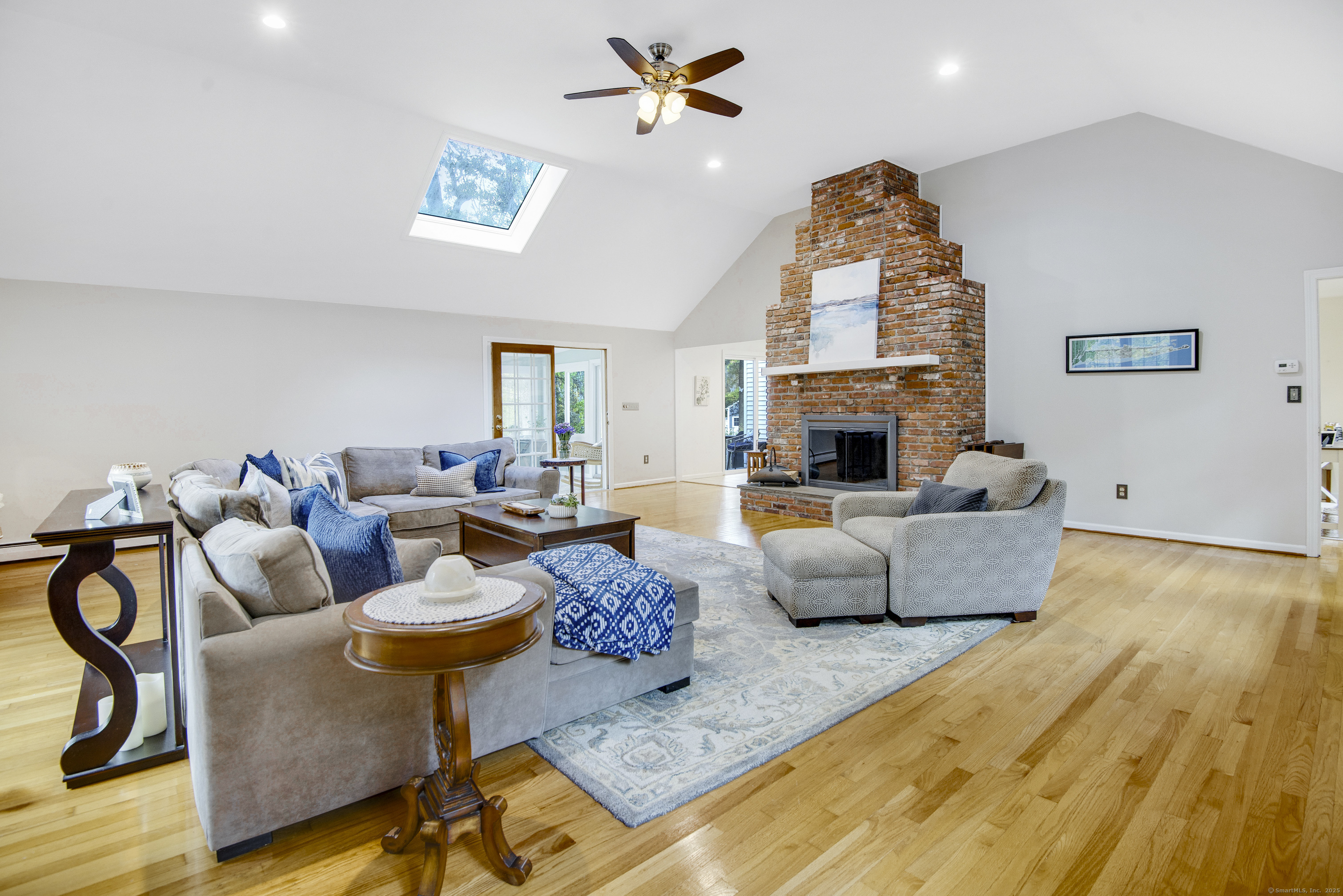 48 Bar Gate Trail Killingworth, CT 06419 - Photo 5 of 40 a living room with fireplace furniture and a chandelier