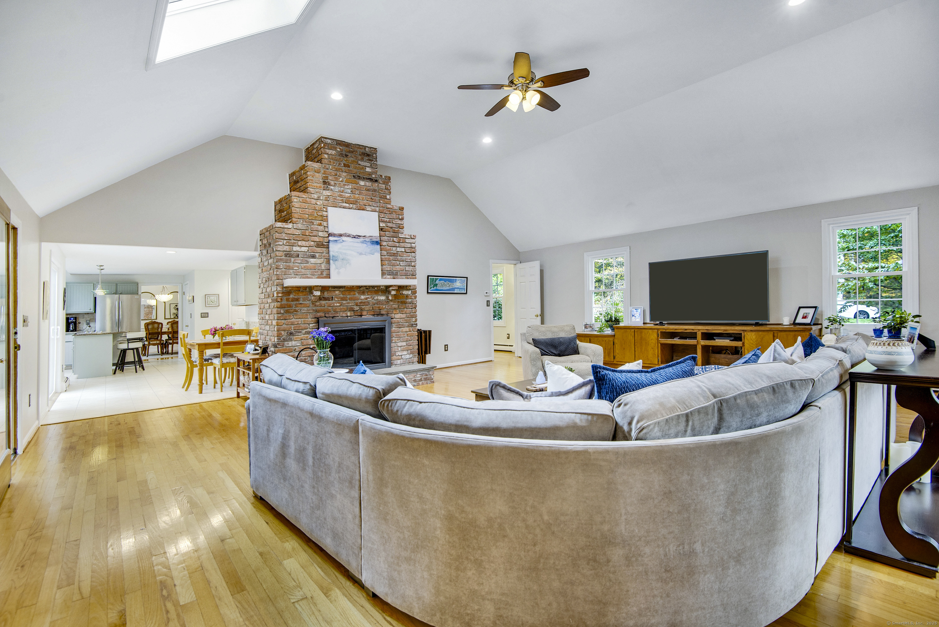 48 Bar Gate Trail Killingworth, CT 06419 - Photo 6 of 40 a living room with fireplace furniture and a flat screen tv