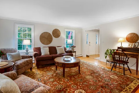 a living room with furniture and a window
