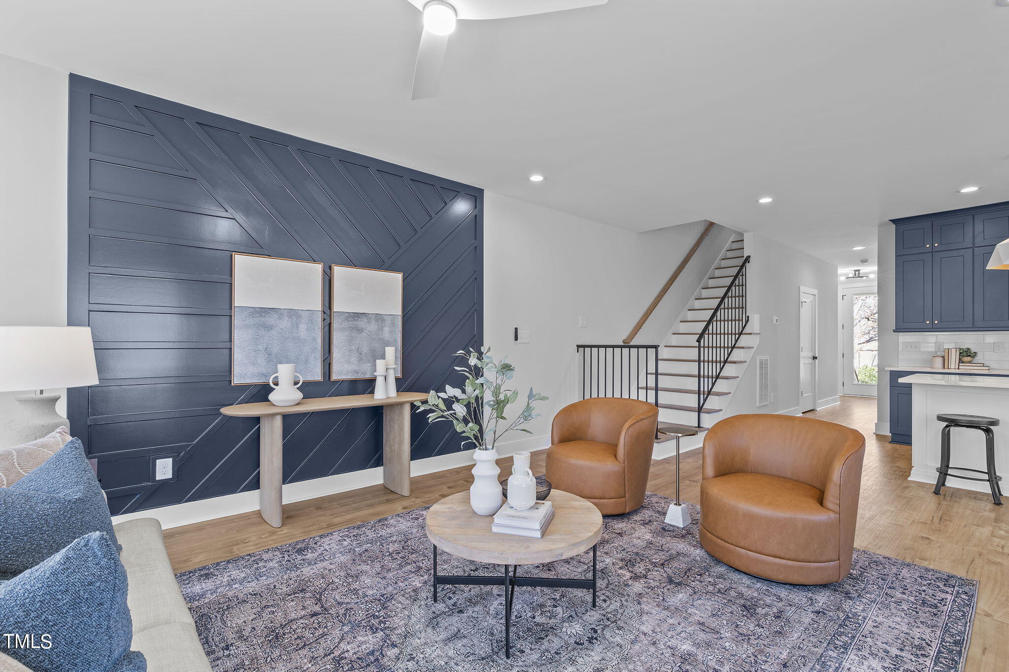 2232 Sheffield Road, Unit 102 Raleigh, NC 27610 - Photo 11 of 32 a living room with furniture and wooden floor
