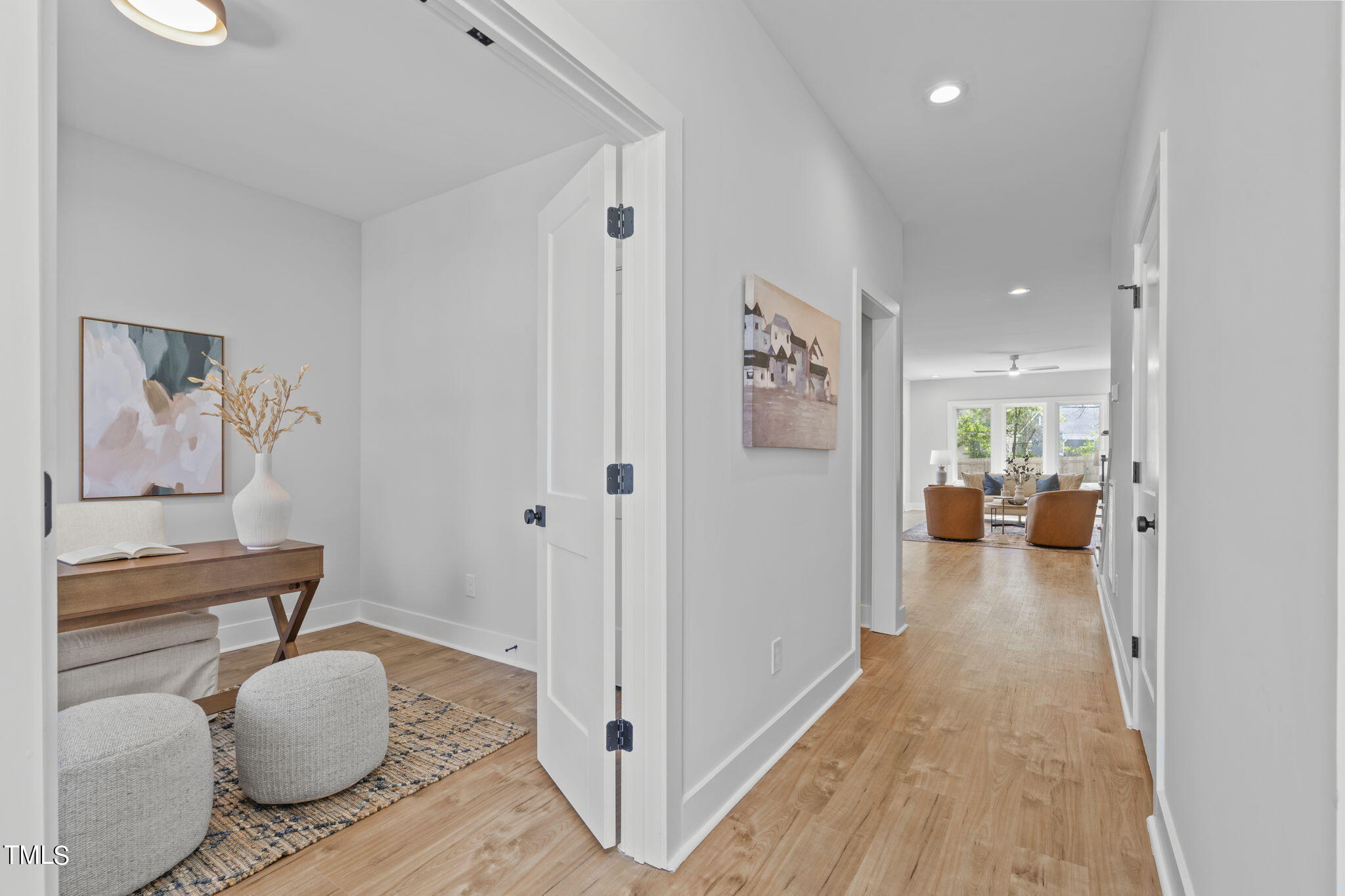 2232 Sheffield Road, Unit 102 Raleigh, NC 27610 - Photo 13 of 32 a view of living room with furniture and wooden floor