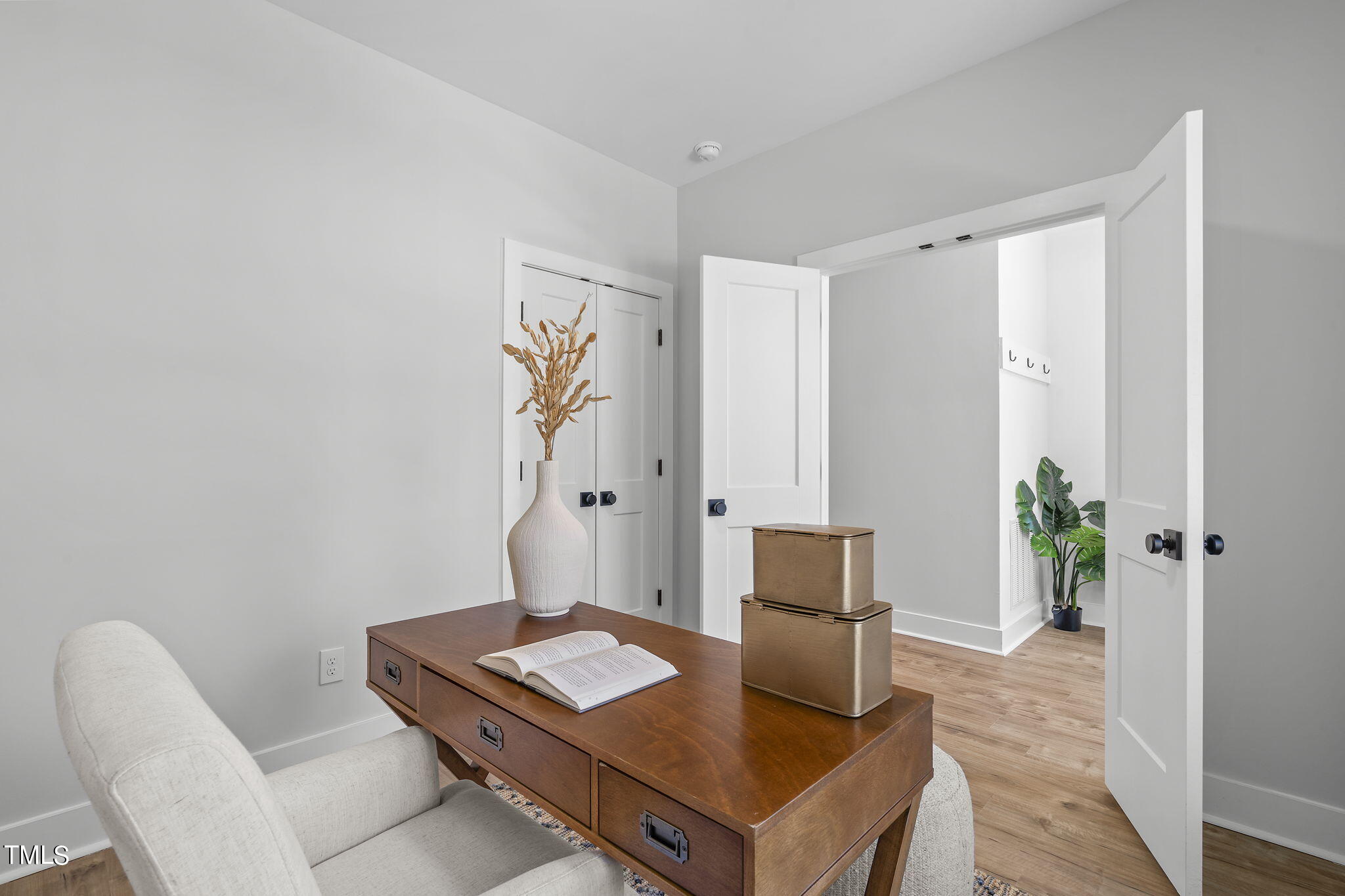 2232 Sheffield Road, Unit 102 Raleigh, NC 27610 - Photo 14 of 32 a living room with furniture and potted plant