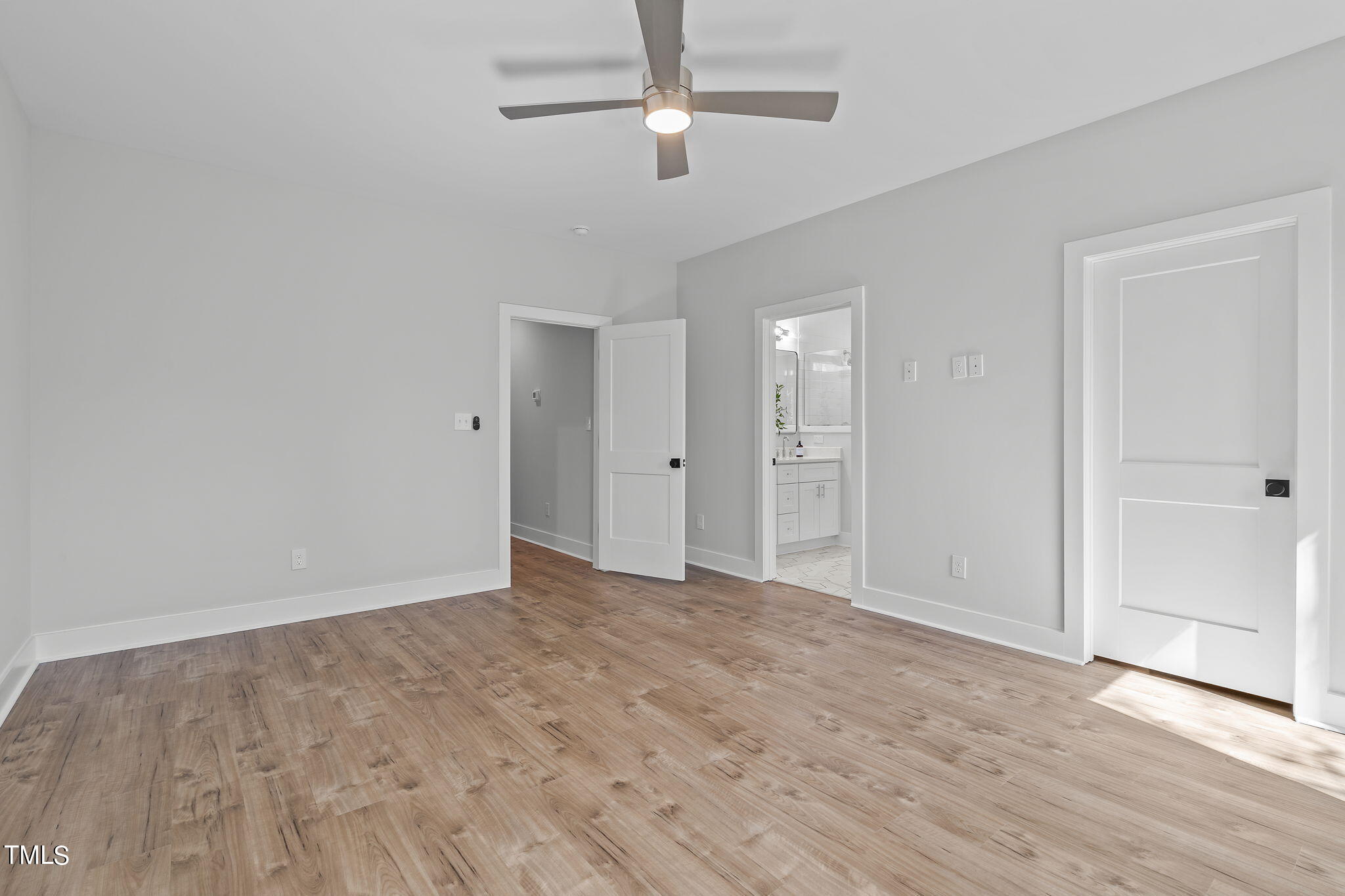 2232 Sheffield Road, Unit 102 Raleigh, NC 27610 - Photo 19 of 32 wooden floor in an empty room with a window