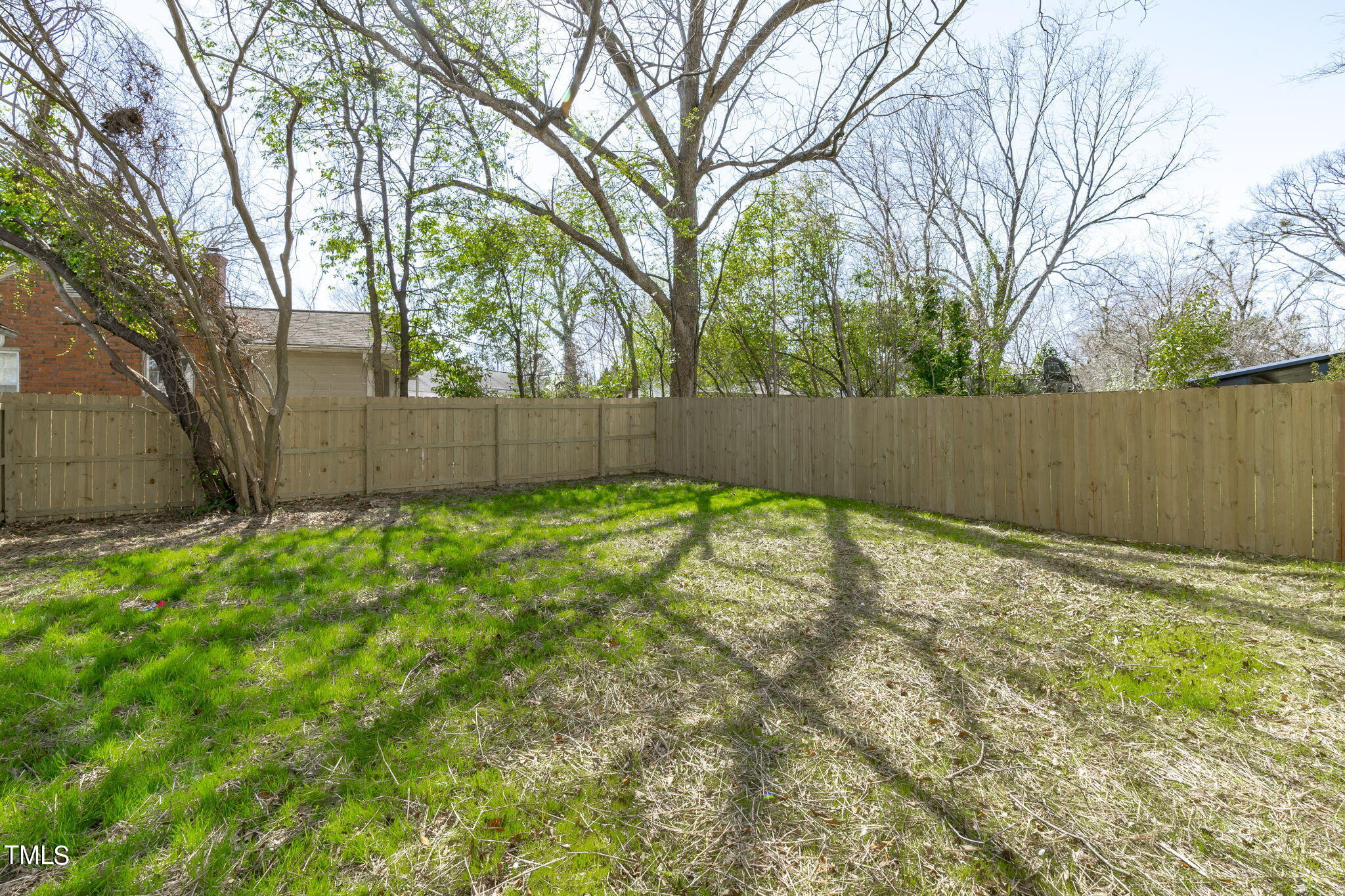 2232 Sheffield Road, Unit 102 Raleigh, NC 27610 - Photo 5 of 32 a view of backyard with tree