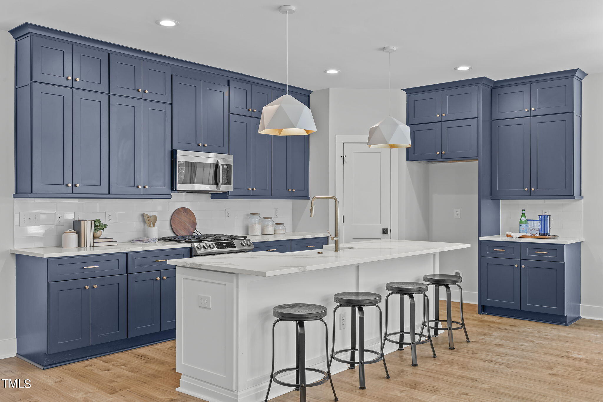 2232 Sheffield Road, Unit 102 Raleigh, NC 27610 - Photo 7 of 32 a kitchen with a sink cabinets and wooden floor