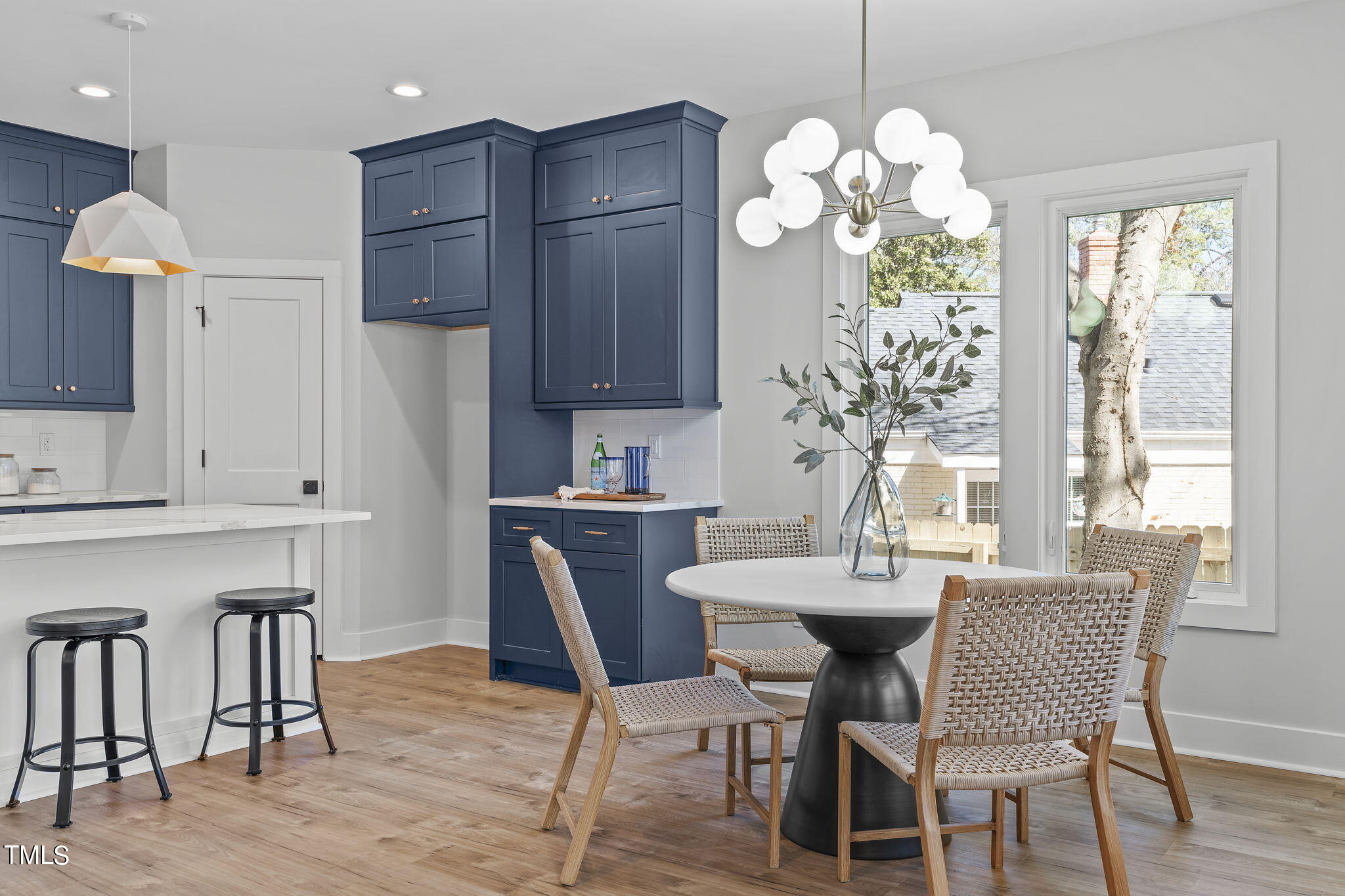 2232 Sheffield Road, Unit 102 Raleigh, NC 27610 - Photo 9 of 32 a dining room filled chandelier and wooden floor