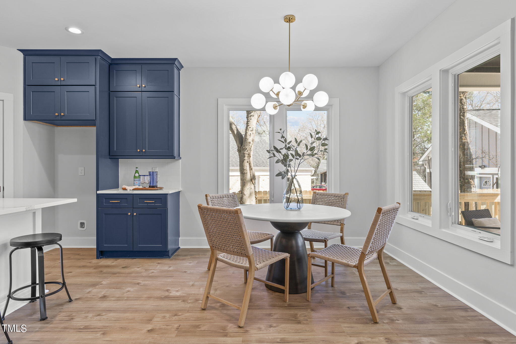 2232 Sheffield Road, Unit 102 Raleigh, NC 27610 - Photo 10 of 32 a view of a dining room with furniture window and wooden floor