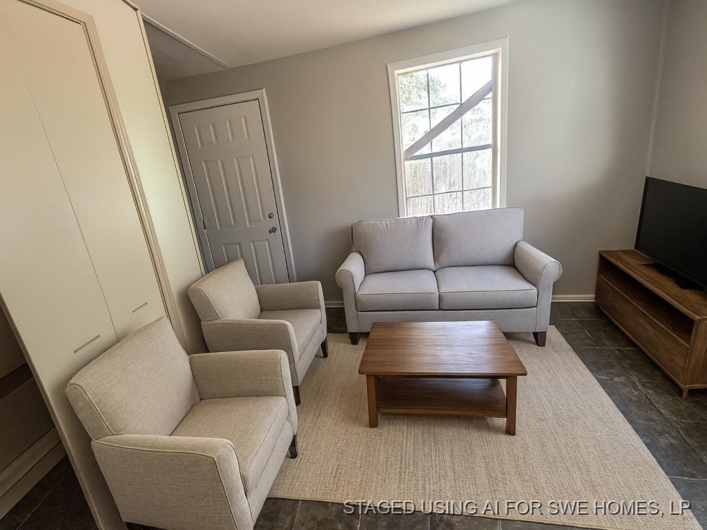 1311 West Grove Street Tyler, TX 75701 - Photo 4 of 14 a living room with furniture a rug and a window