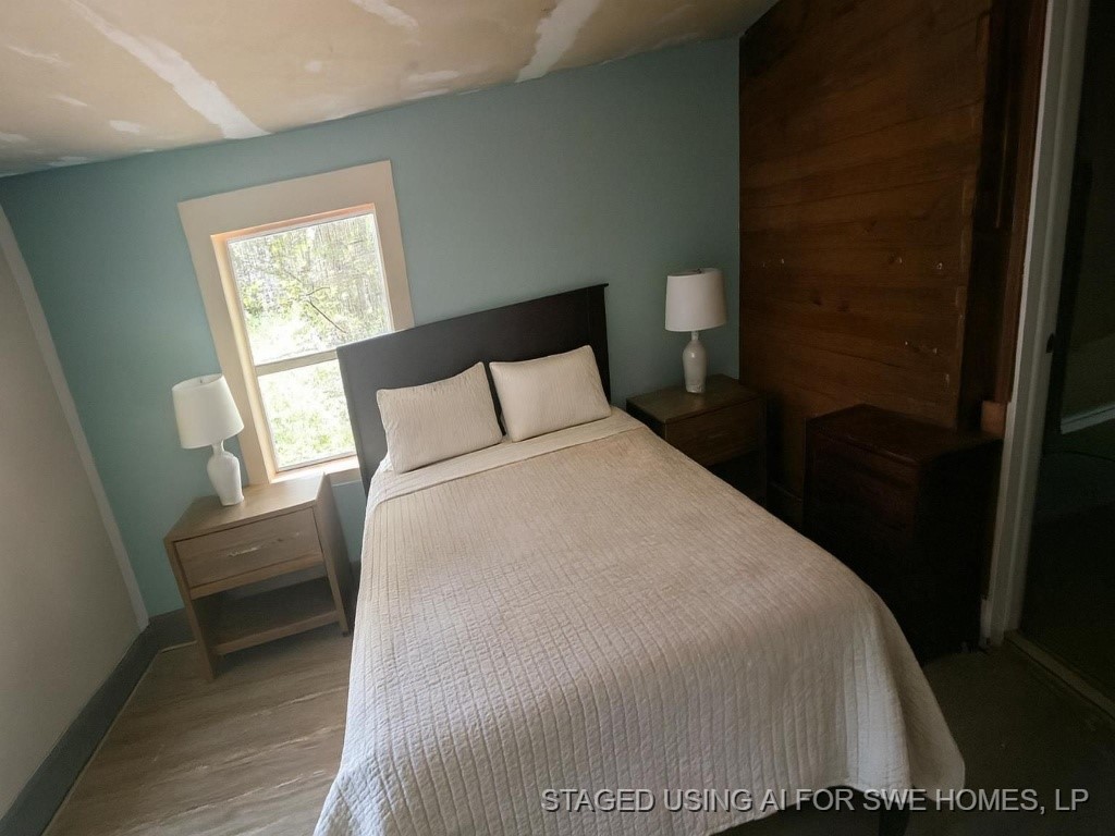 1311 West Grove Street Tyler, TX 75701 - Photo 8 of 14 a bedroom with a bed and a window