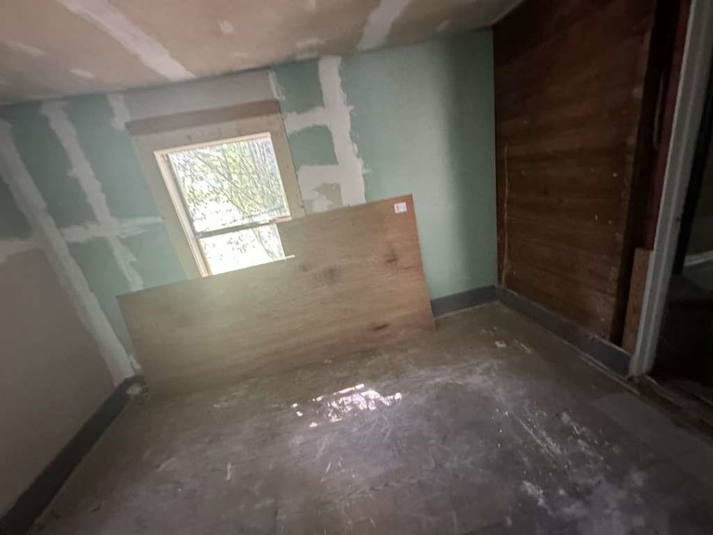 1311 West Grove Street Tyler, TX 75701 - Photo 8 of 12 an empty room with windows