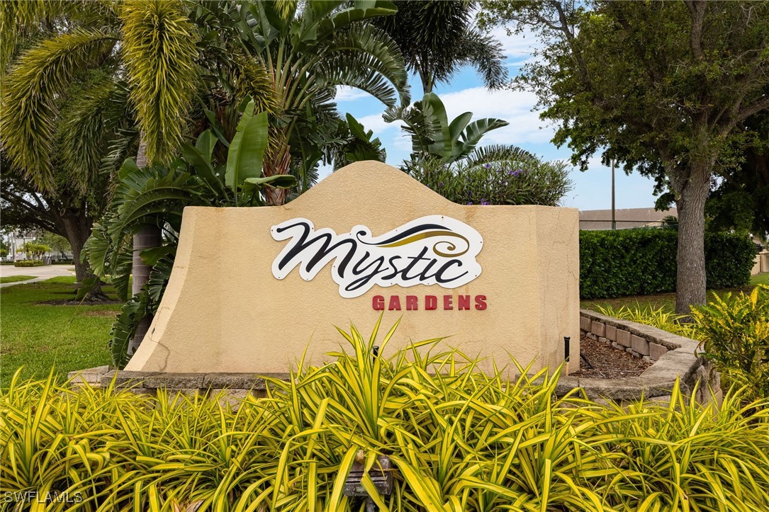 5315 Summerlin Road, Unit 1514 Fort Myers, FL 33919 - Photo 13 of 17 a sign that is sitting on a road near a garden